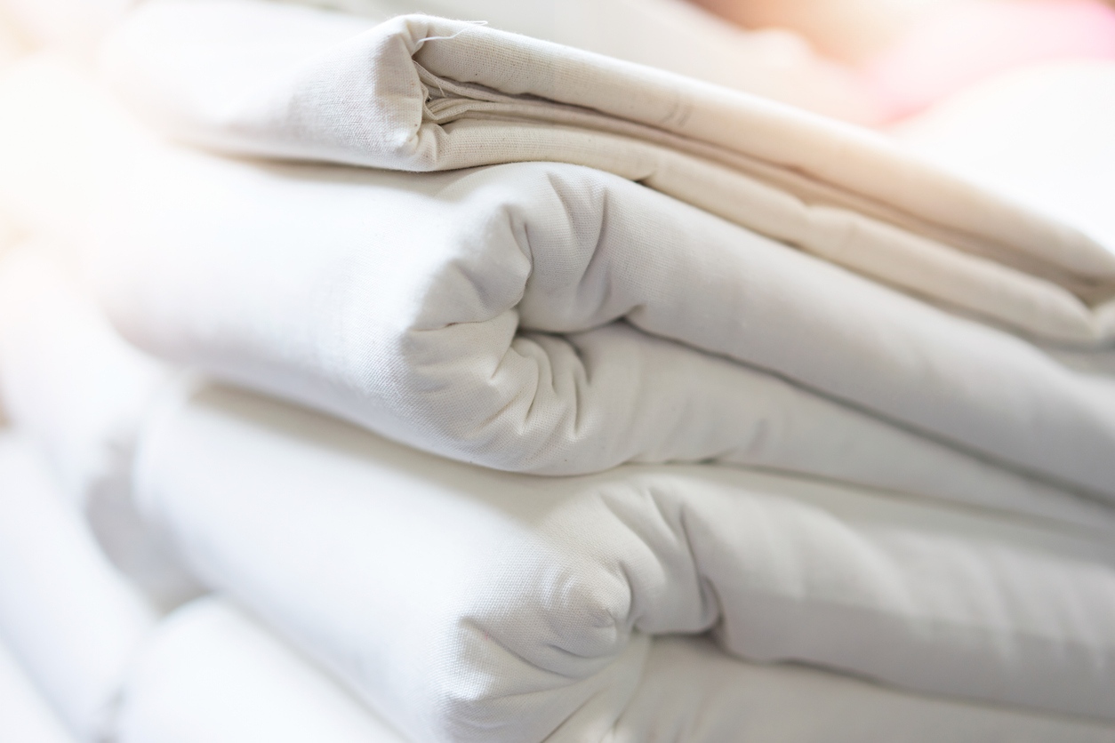 stack of folded bedding